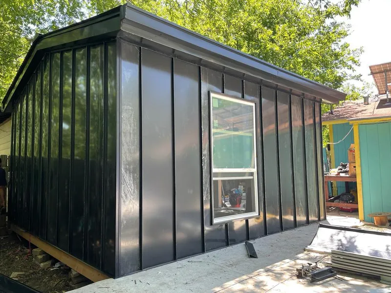 Black standing seam metal wall panels for Roof Inspection in Westtown