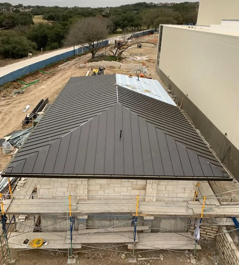 Metal roof new construction with scaffolding in Westtown